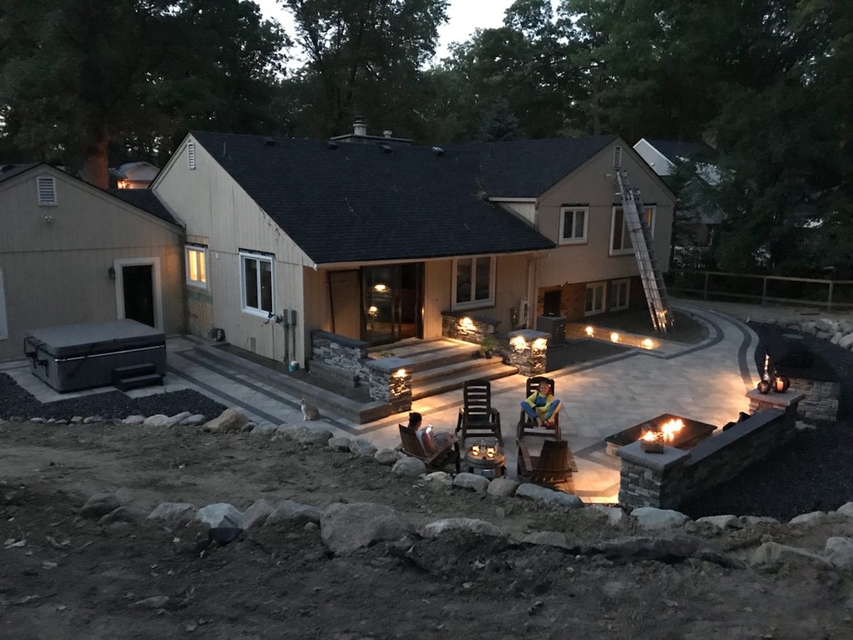 Complete backyard with fire pit, hot tub, patio and lighting