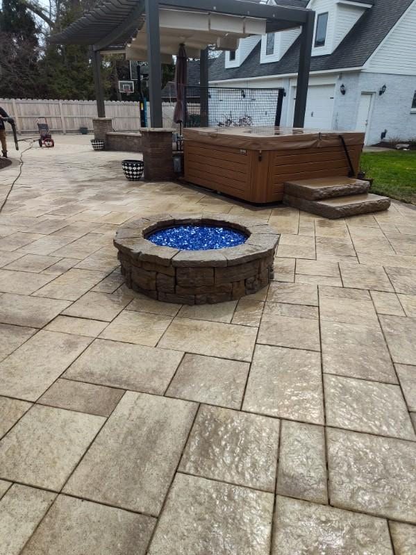 Fire pit with blue glass and hot tub