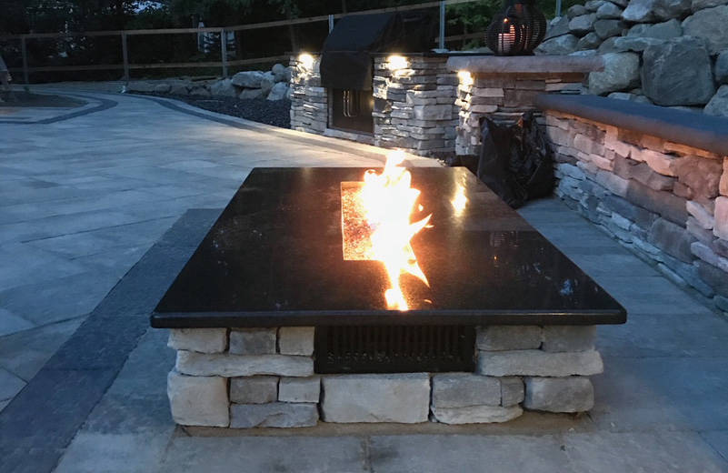  paver patio with modern stone fireplace